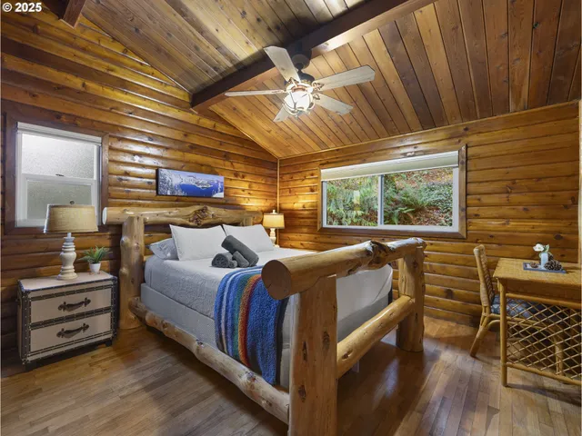 a bed room with a bed and a window