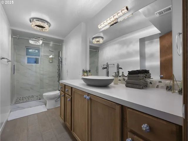 a bathroom with a double vanity sink and a mirror
