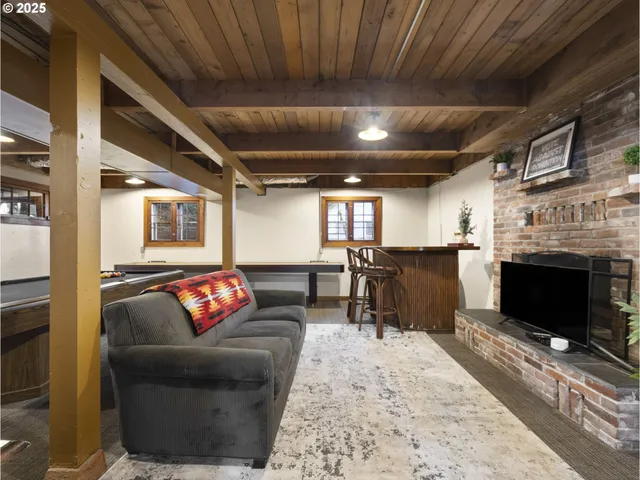 a living room with fireplace furniture and a fireplace