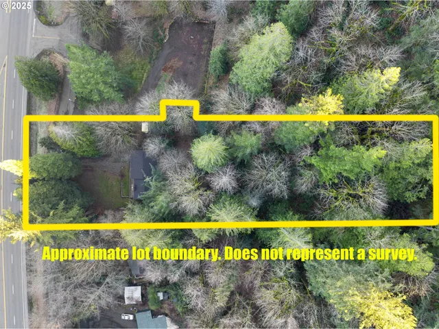 a view of swimming pool with outdoor seating and a garden