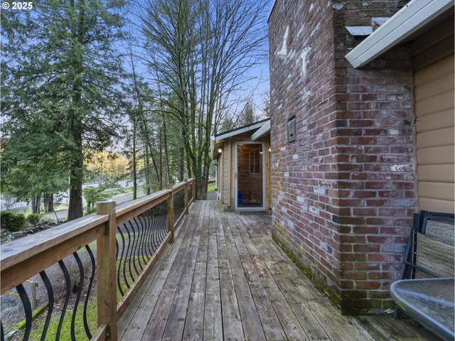 a view of a balcony with wooden floor