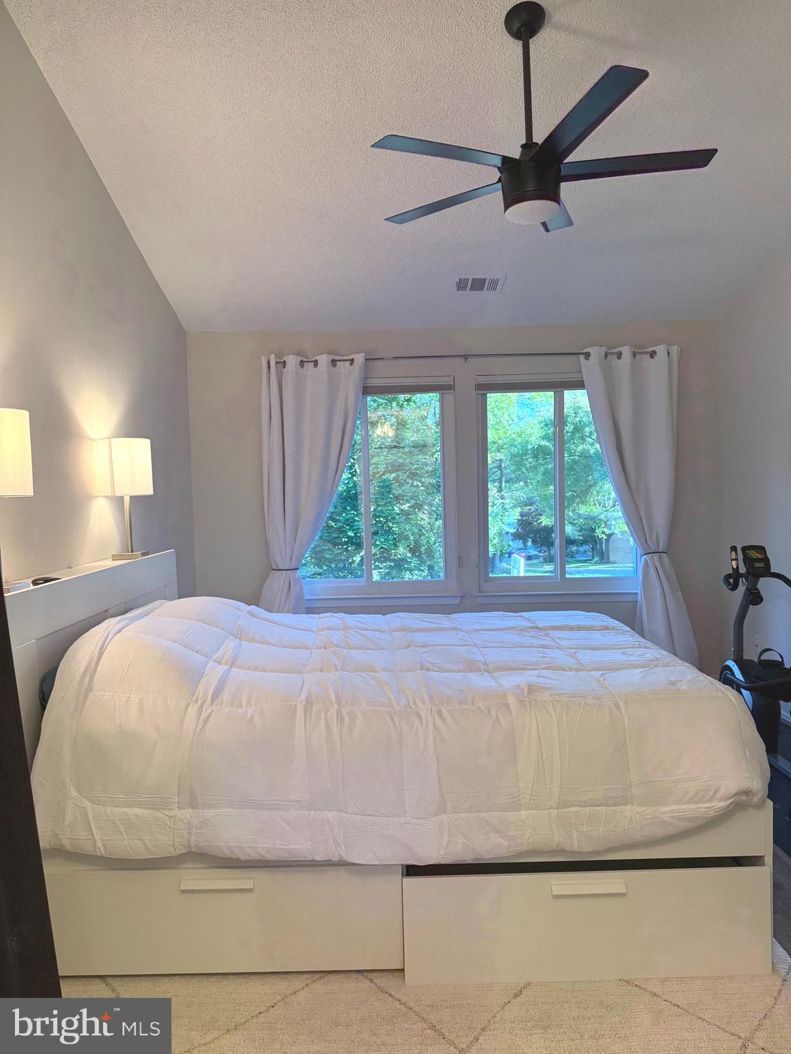 11743 Summerchase Circle, Unit B Reston, VA 20194 - Photo 6 of 25 a bedroom with a bed and window