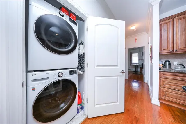 a view of a hallway with washer and dryer