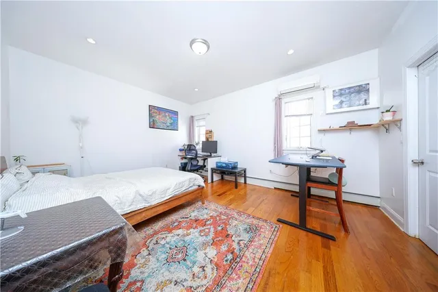 a bed room with a bed and a chair