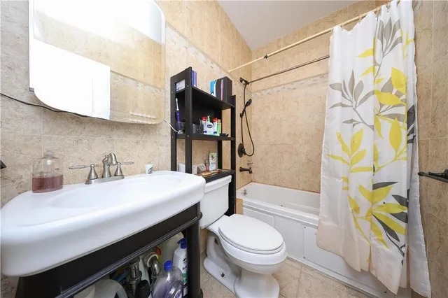 a bathroom with a sink a toilet and a bathtub