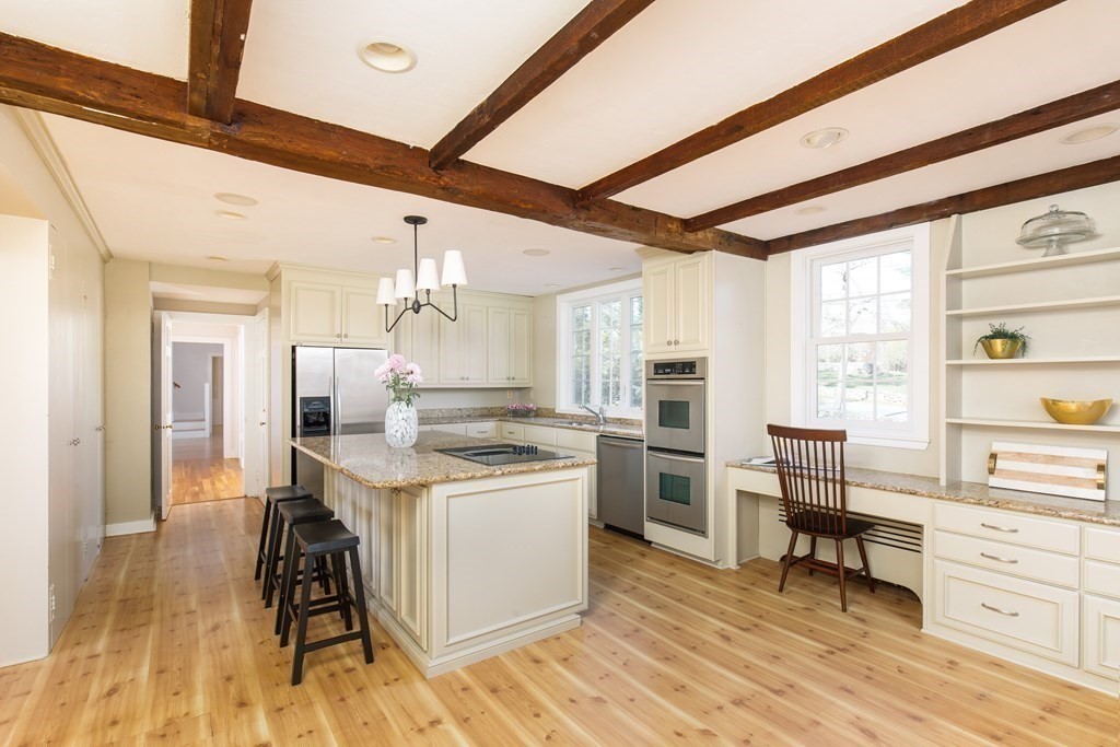 55 Sunset Rock Road Andover, MA 01810 - Photo 13 of 36 a kitchen with a stove a refrigerator and cabinets