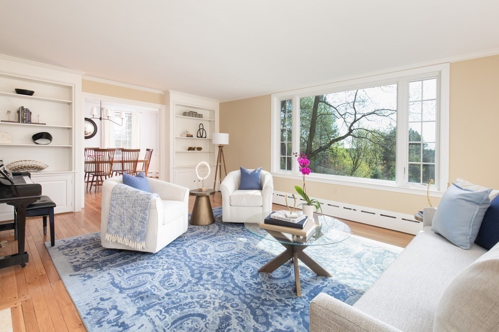 55 Sunset Rock Road Andover, MA 01810 - Photo 17 of 36 a living room with furniture and a large window