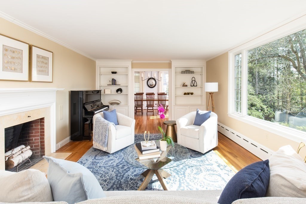 55 Sunset Rock Road Andover, MA 01810 - Photo 18 of 36 a living room with furniture and a fireplace