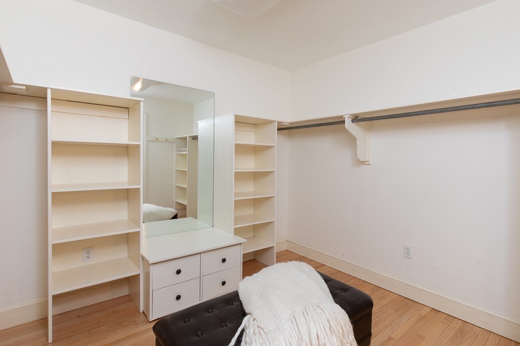 55 Sunset Rock Road Andover, MA 01810 - Photo 23 of 36 a room with a wooden floor and closet