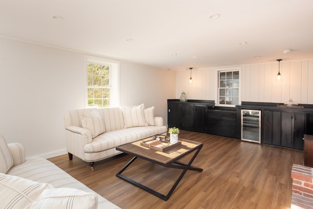 55 Sunset Rock Road Andover, MA 01810 - Photo 30 of 36 a living room with furniture and a wooden floor