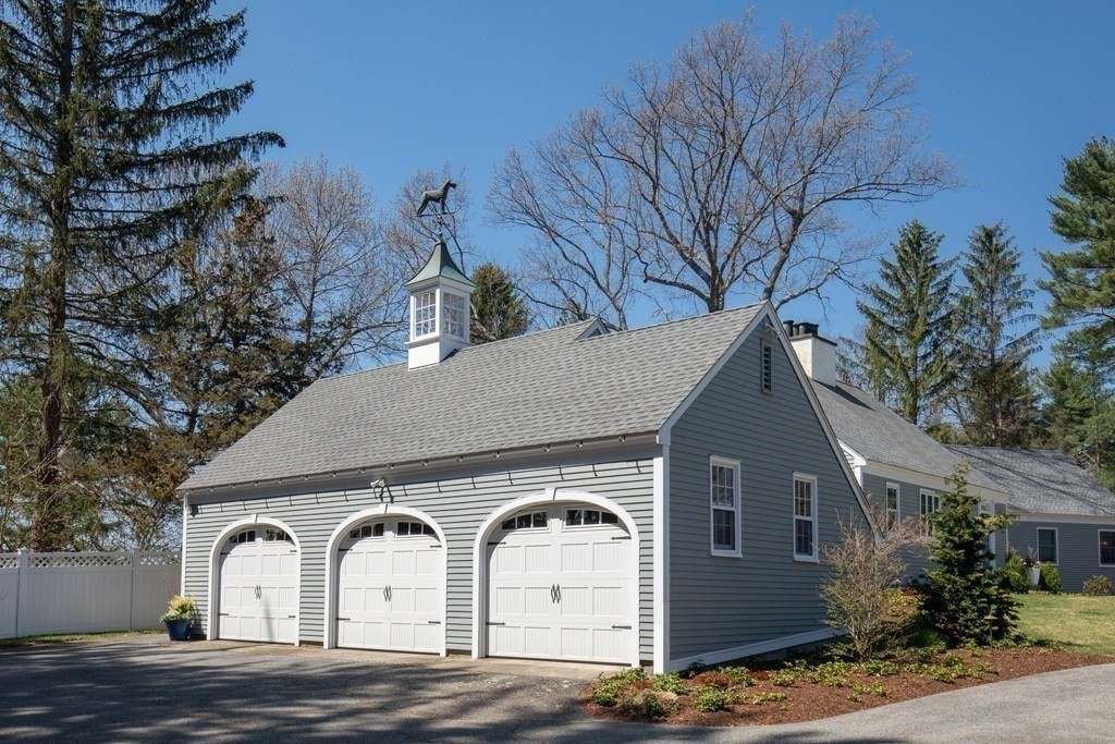 55 Sunset Rock Road Andover, MA 01810 - Photo 31 of 36 a front view of a house with garden