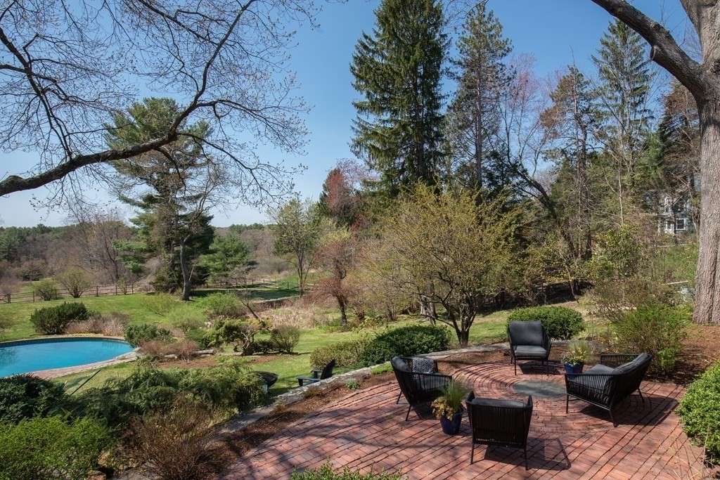 55 Sunset Rock Road Andover, MA 01810 - Photo 6 of 36 a view of backyard with outdoor seating and green space