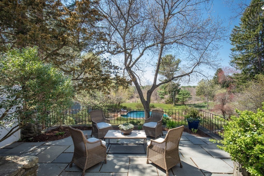 55 Sunset Rock Road Andover, MA 01810 - Photo 9 of 36 a view of backyard with outdoor seating and trees