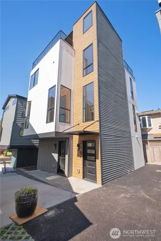 a front view of a house with parking space