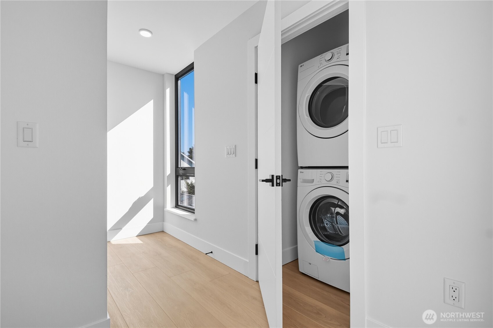 218 21st Avenue East Seattle, WA 98112 - Photo 11 of 38 a view of a hallway with washer and dryer