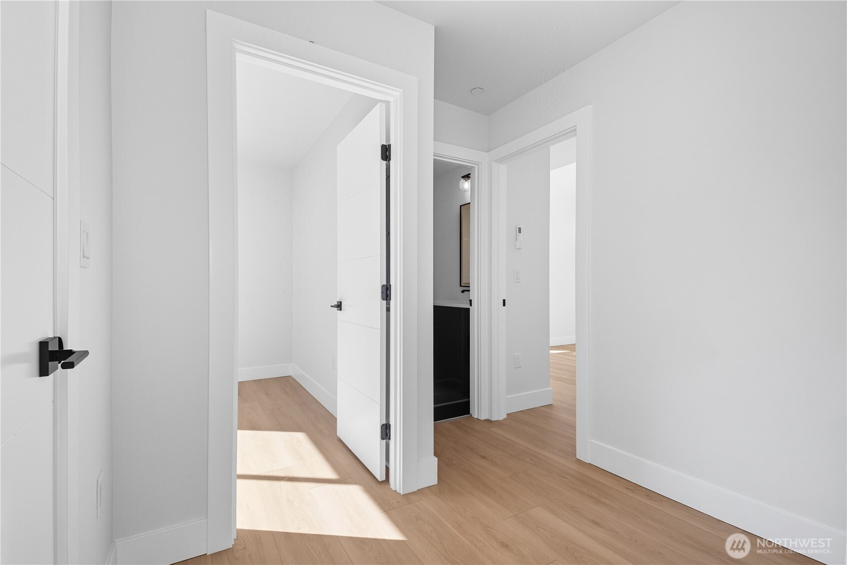 218 21st Avenue East Seattle, WA 98112 - Photo 13 of 38 a view of a hallway with wooden floor and closet