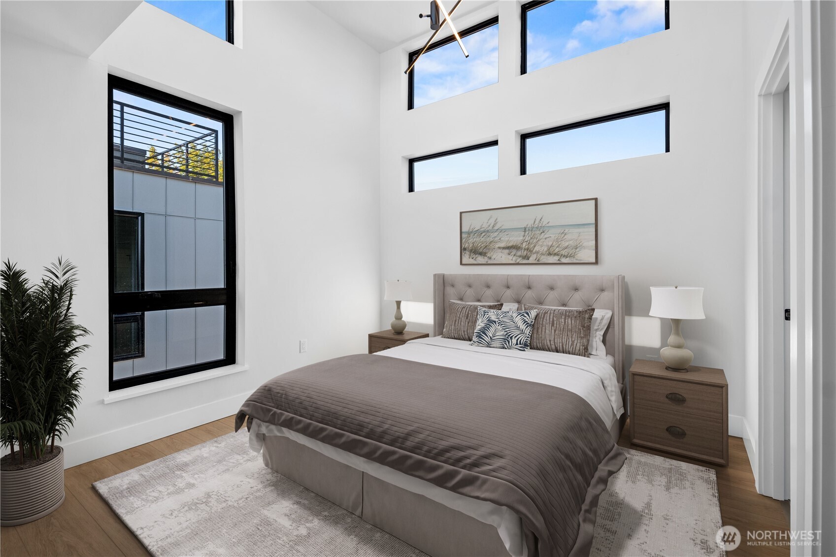 218 21st Avenue East Seattle, WA 98112 - Photo 14 of 38 a bedroom with a bed and a window