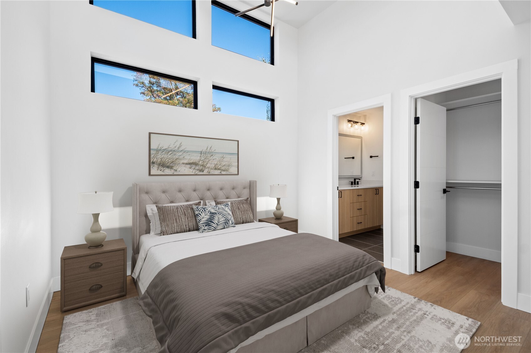 218 21st Avenue East Seattle, WA 98112 - Photo 15 of 38 a bedroom with a bed and a view of bathroom
