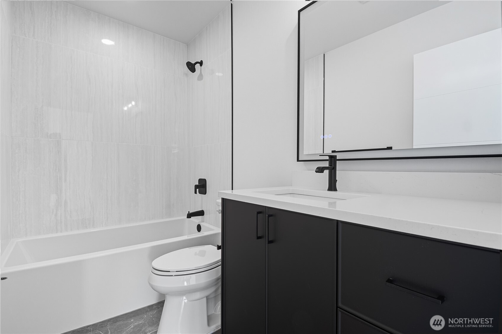 218 21st Avenue East Seattle, WA 98112 - Photo 18 of 38 a bathroom with a sink a toilet and shower