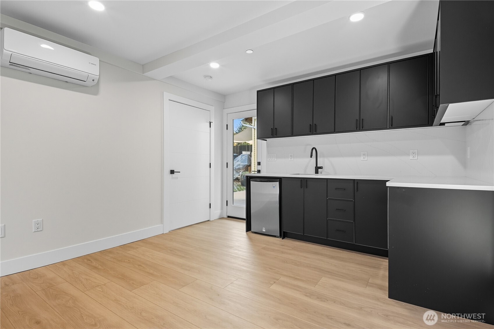 218 21st Avenue East Seattle, WA 98112 - Photo 21 of 38 a kitchen with a sink and cabinets