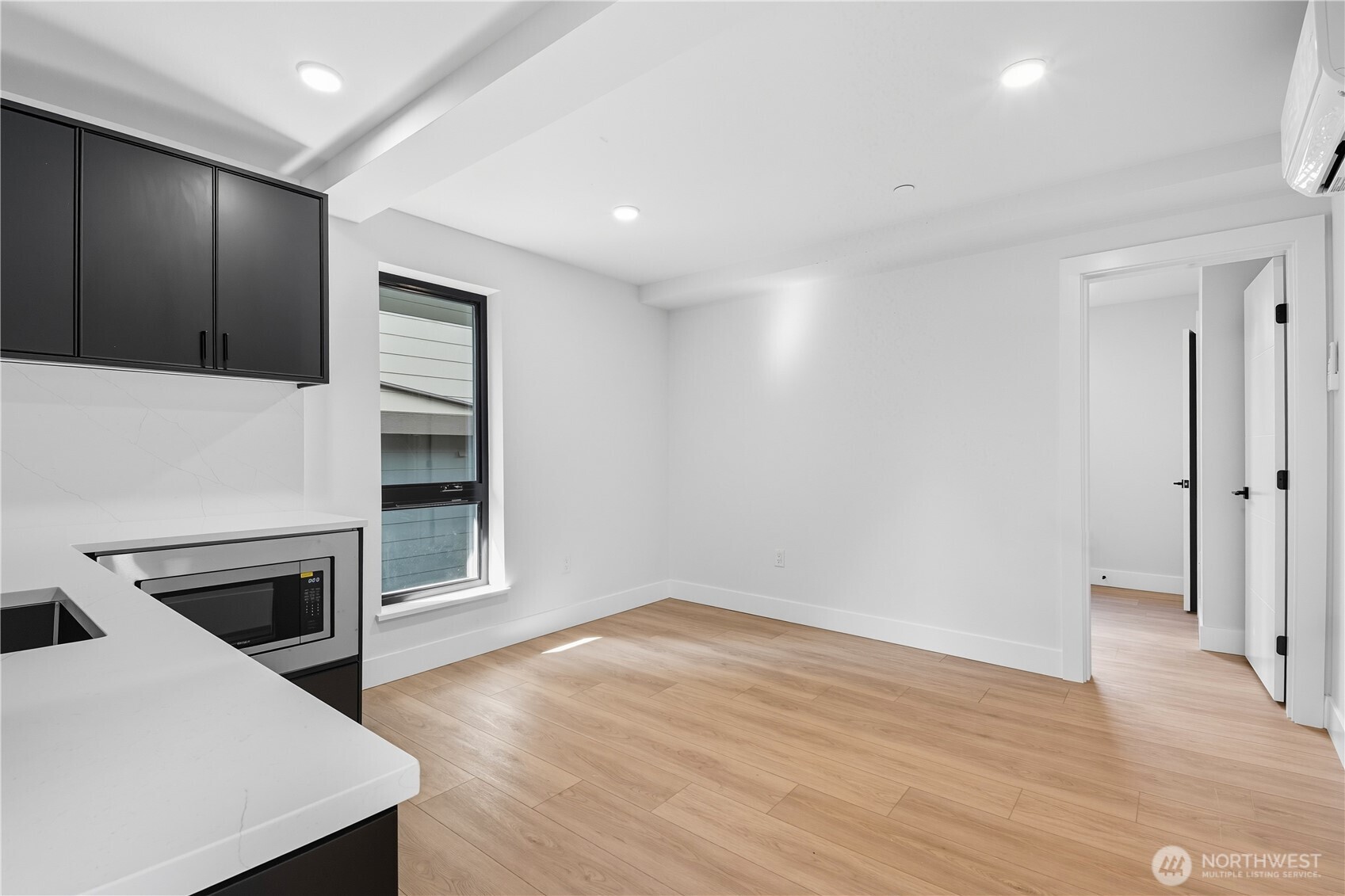 218 21st Avenue East Seattle, WA 98112 - Photo 22 of 38 a view of a kitchen with a sink and a stove top oven