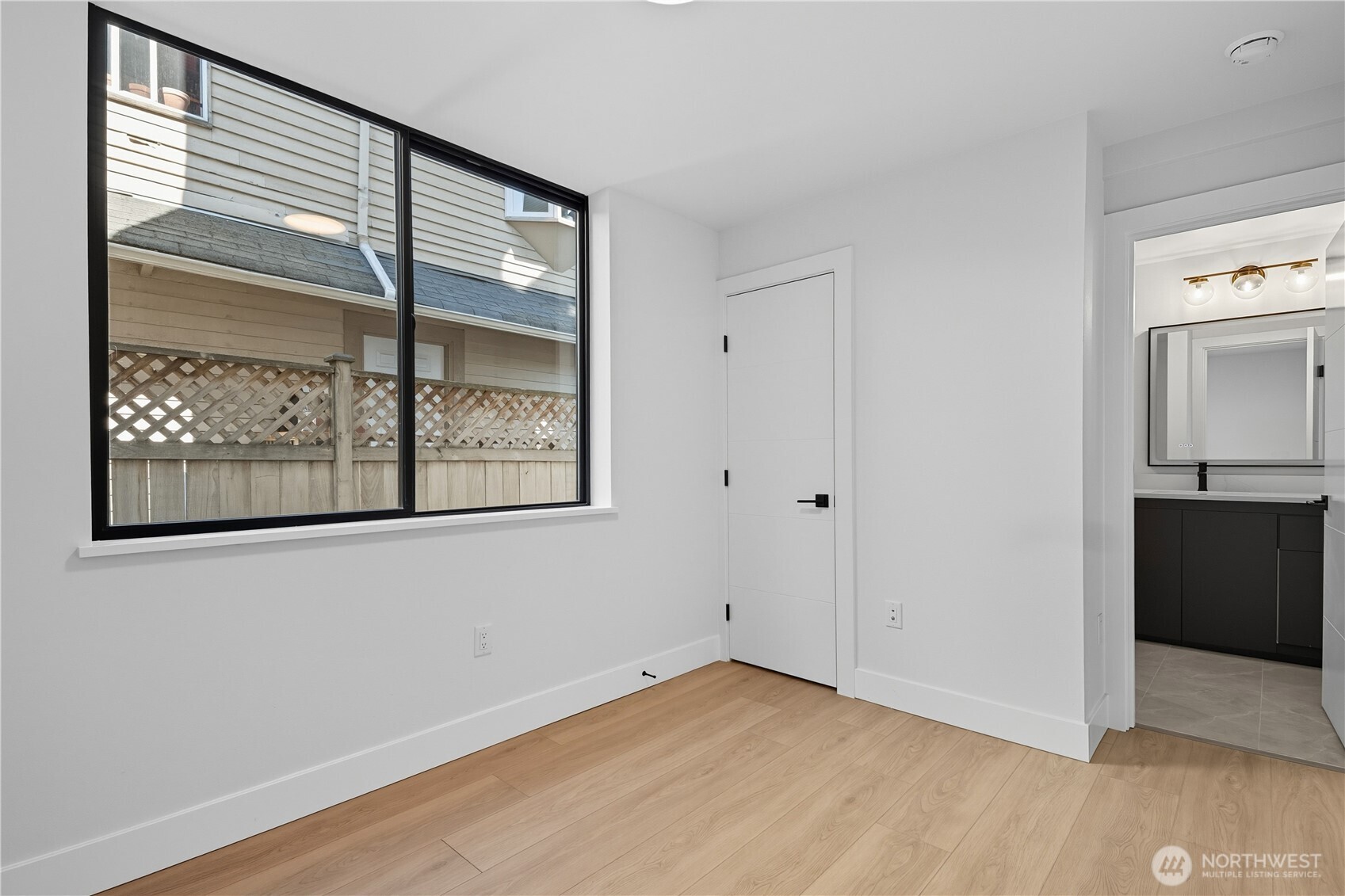 218 21st Avenue East Seattle, WA 98112 - Photo 23 of 38 a view of an empty room with window and cabinet