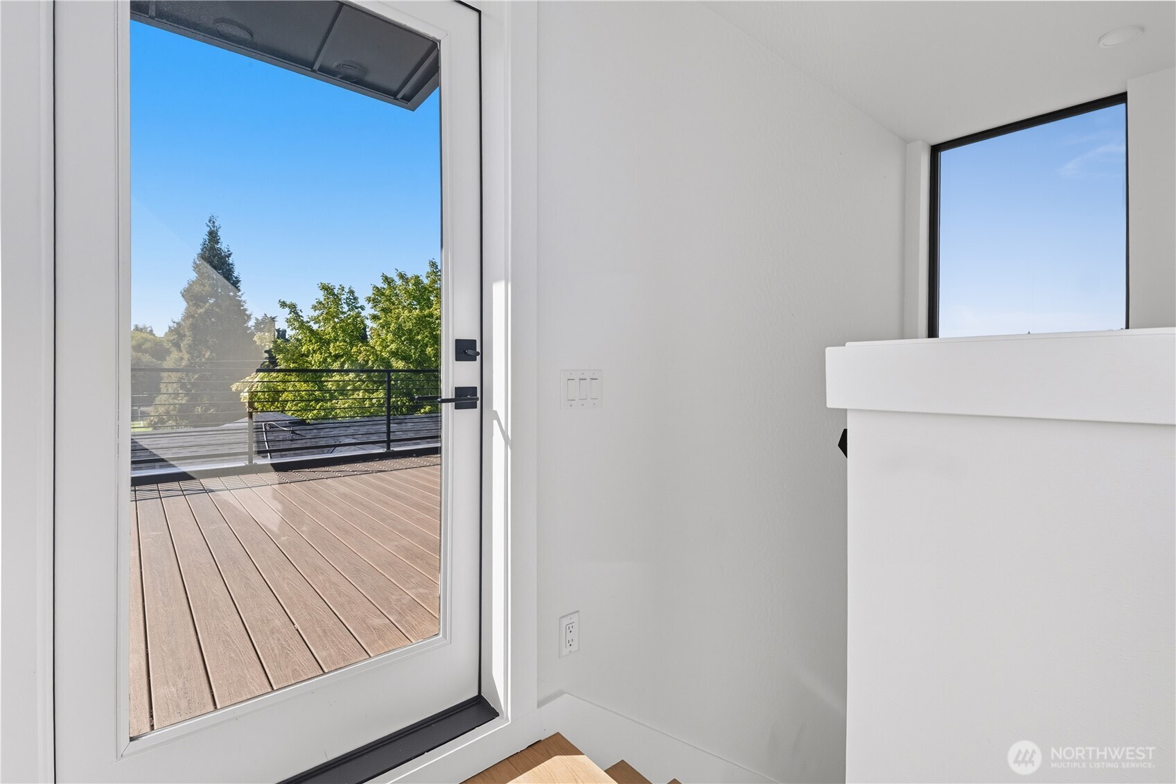 218 21st Avenue East Seattle, WA 98112 - Photo 26 of 38 a view of a hallway with wooden floor