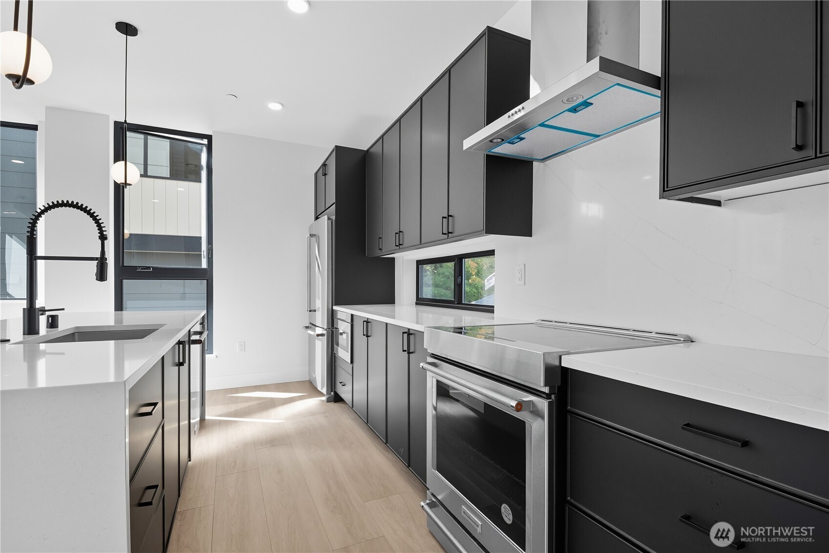 218 21st Avenue East Seattle, WA 98112 - Photo 7 of 38 a kitchen with a sink appliances and cabinets