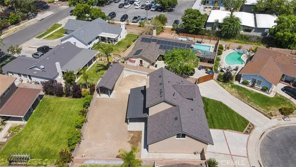an aerial view of residential houses with outdoor space