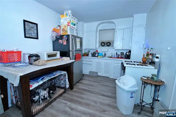 a kitchen with a sink cabinets and stove