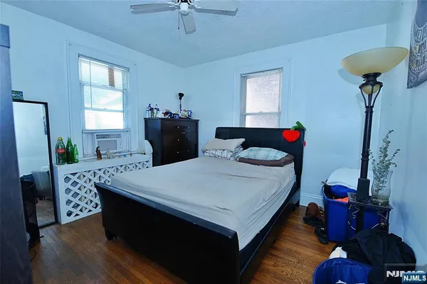 a bed room with a bed and a chandelier