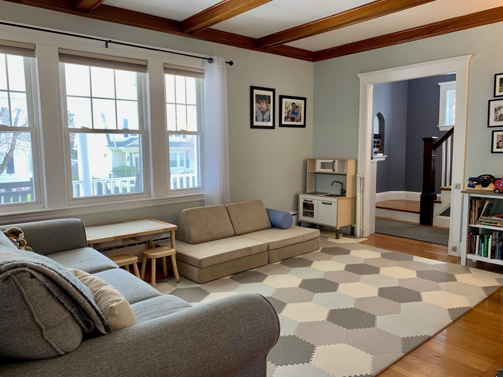 15 Maypole Road Quincy, MA 02169 - Photo 12 of 28 a bedroom with furniture and a window