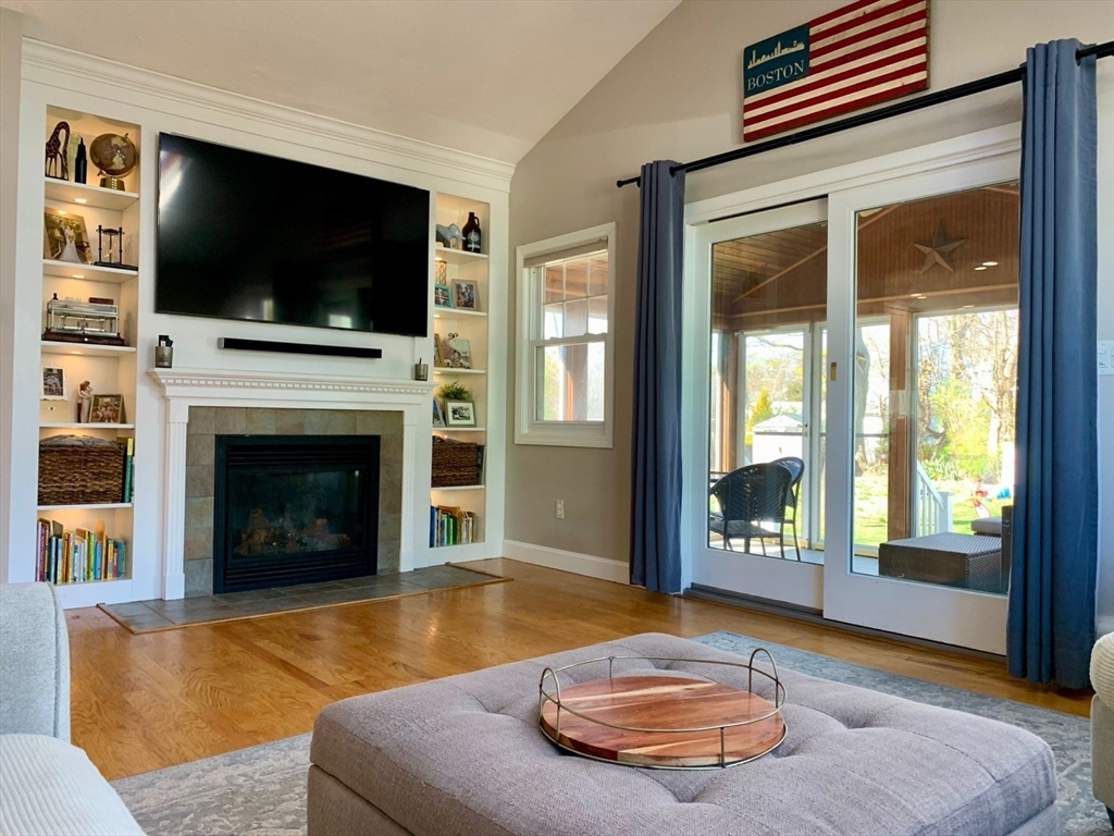 15 Maypole Road Quincy, MA 02169 - Photo 2 of 28 a living room with furniture and a flat screen tv