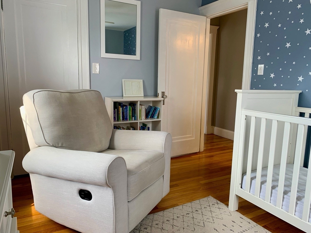 15 Maypole Road Quincy, MA 02169 - Photo 21 of 28 a living room with furniture and a rug