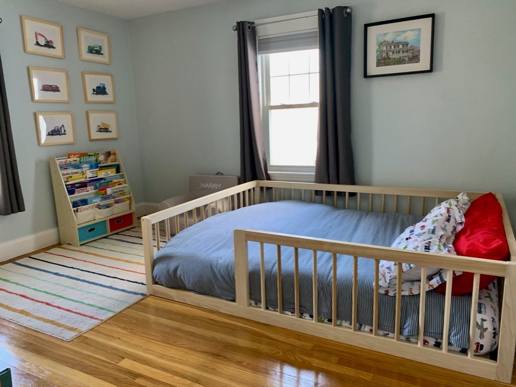 15 Maypole Road Quincy, MA 02169 - Photo 23 of 28 a bedroom with bed and a window