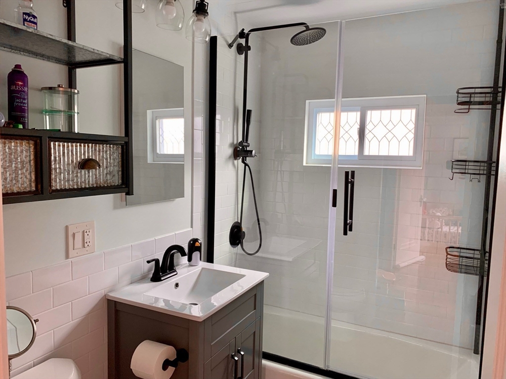 15 Maypole Road Quincy, MA 02169 - Photo 24 of 28 a bathroom with a sink toilet and shower