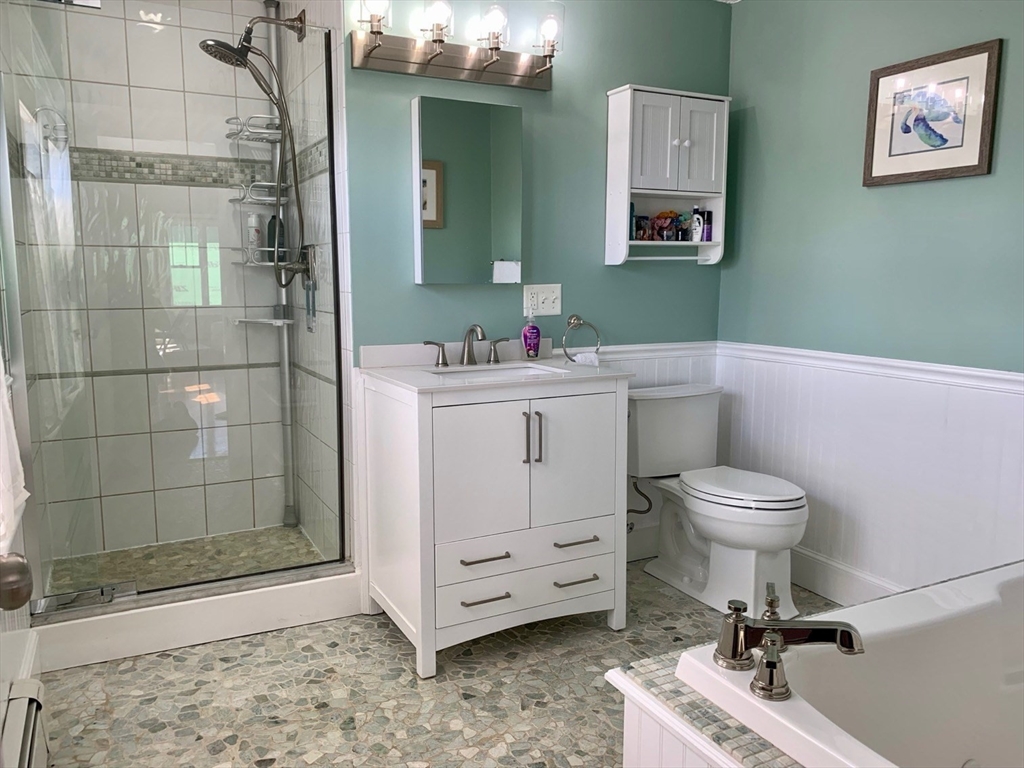 15 Maypole Road Quincy, MA 02169 - Photo 27 of 28 a bathroom with a toilet a sink and shower