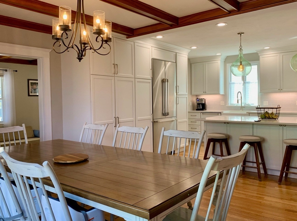 15 Maypole Road Quincy, MA 02169 - Photo 6 of 28 a view of a dining room with furniture and wooden floor