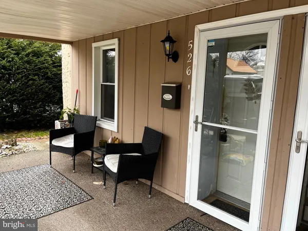 a view of a livingroom with furniture and front door