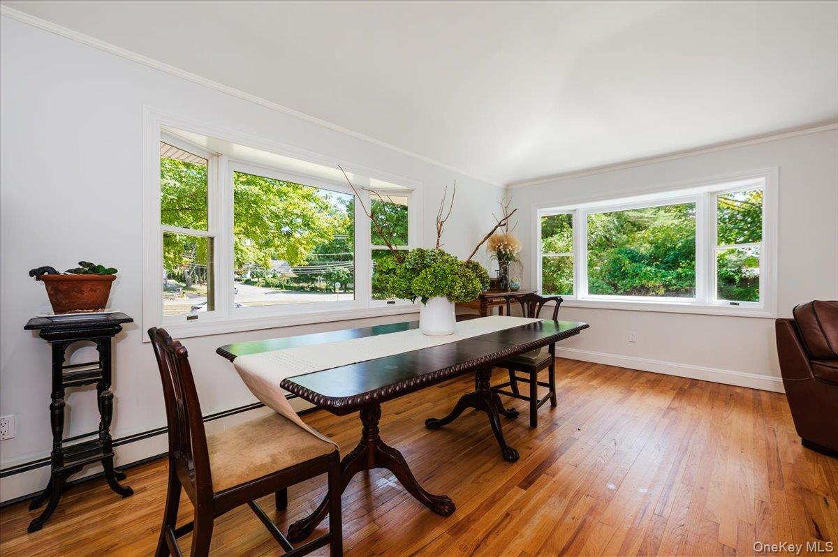 237 Oakwood Road Huntington, NY 11743 - Photo 11 of 29 a dining room with furniture and wooden floor
