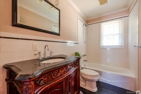 a bathroom with a sink a toilet and a bathtub