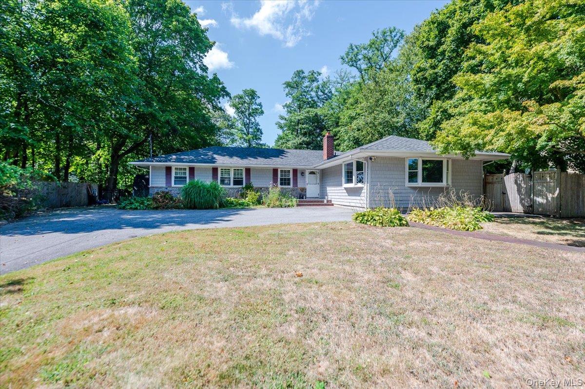 237 Oakwood Road Huntington, NY 11743 - Photo 2 of 29 a front view of a house with garden