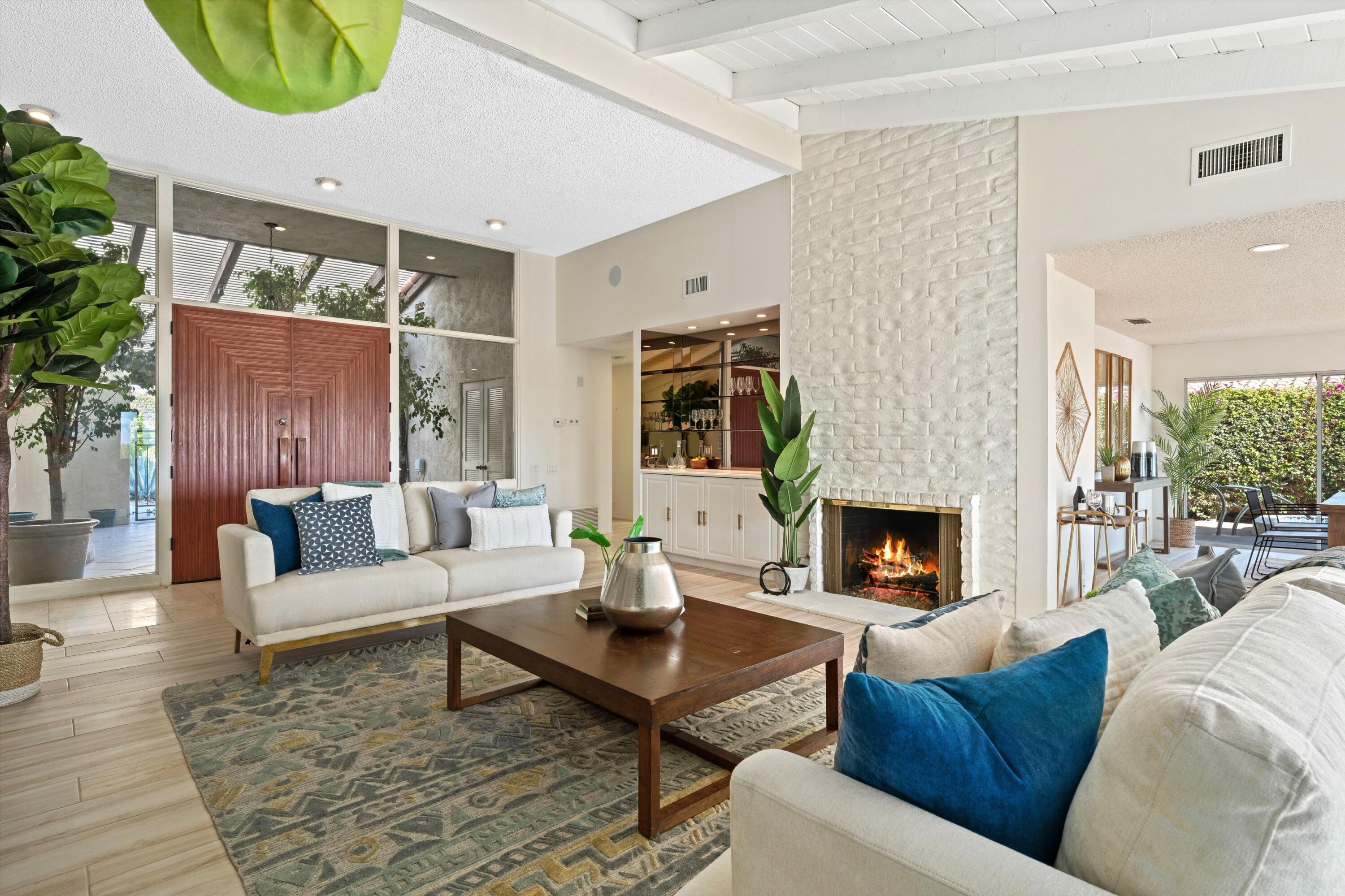 40270 Paseo Del Rey Rancho Mirage, CA 92270 - Photo 1 of 41 a living room with furniture and a fireplace