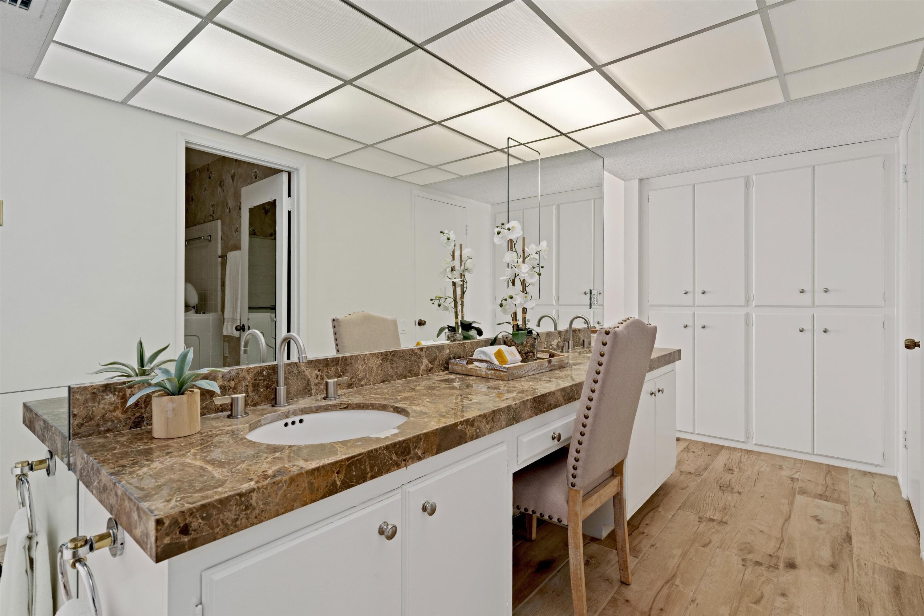 40270 Paseo Del Rey Rancho Mirage, CA 92270 - Photo 23 of 41 a bathroom with a granite countertop sink and a mirror