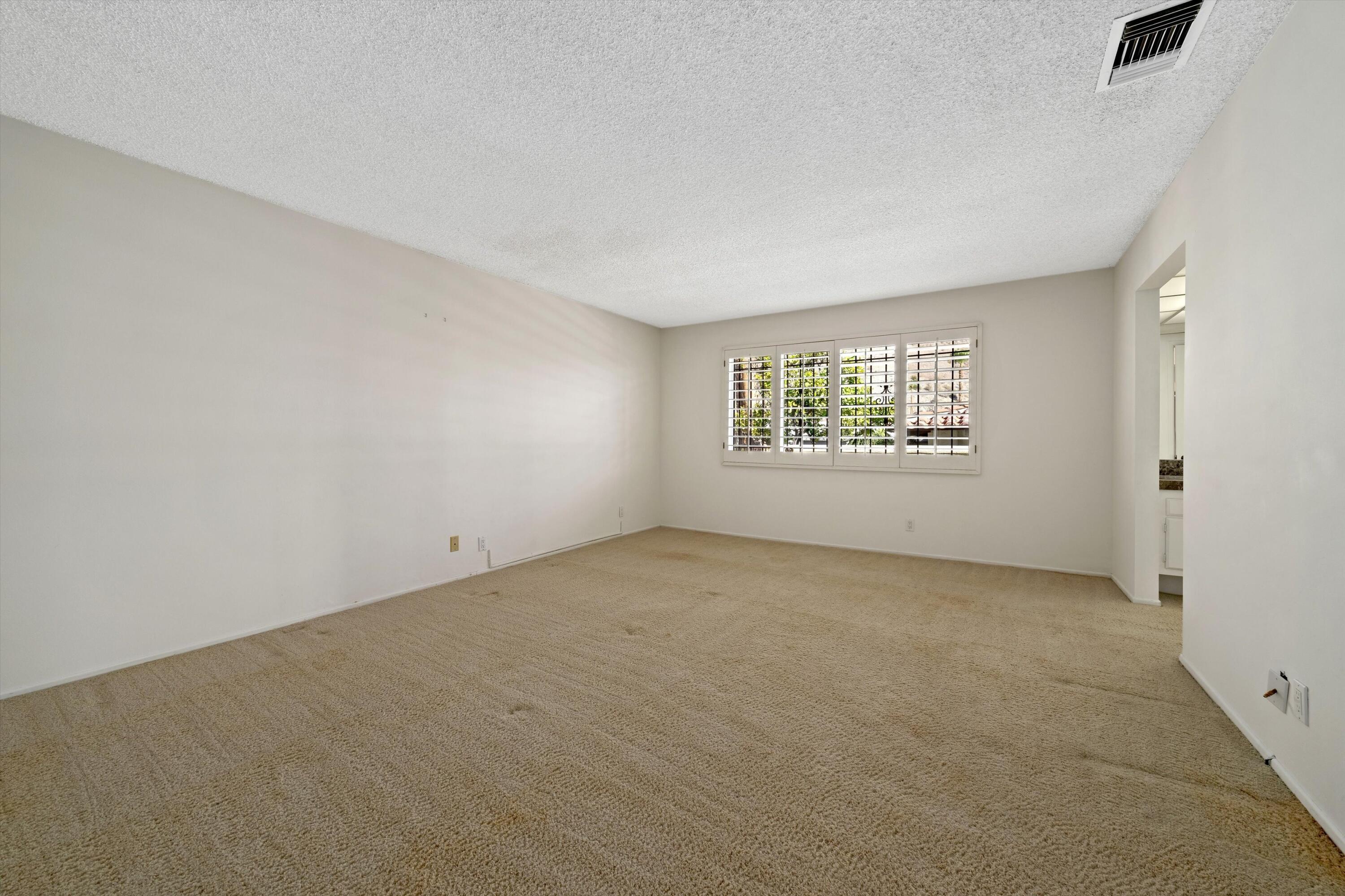 40270 Paseo Del Rey Rancho Mirage, CA 92270 - Photo 26 of 41 an empty room with a window