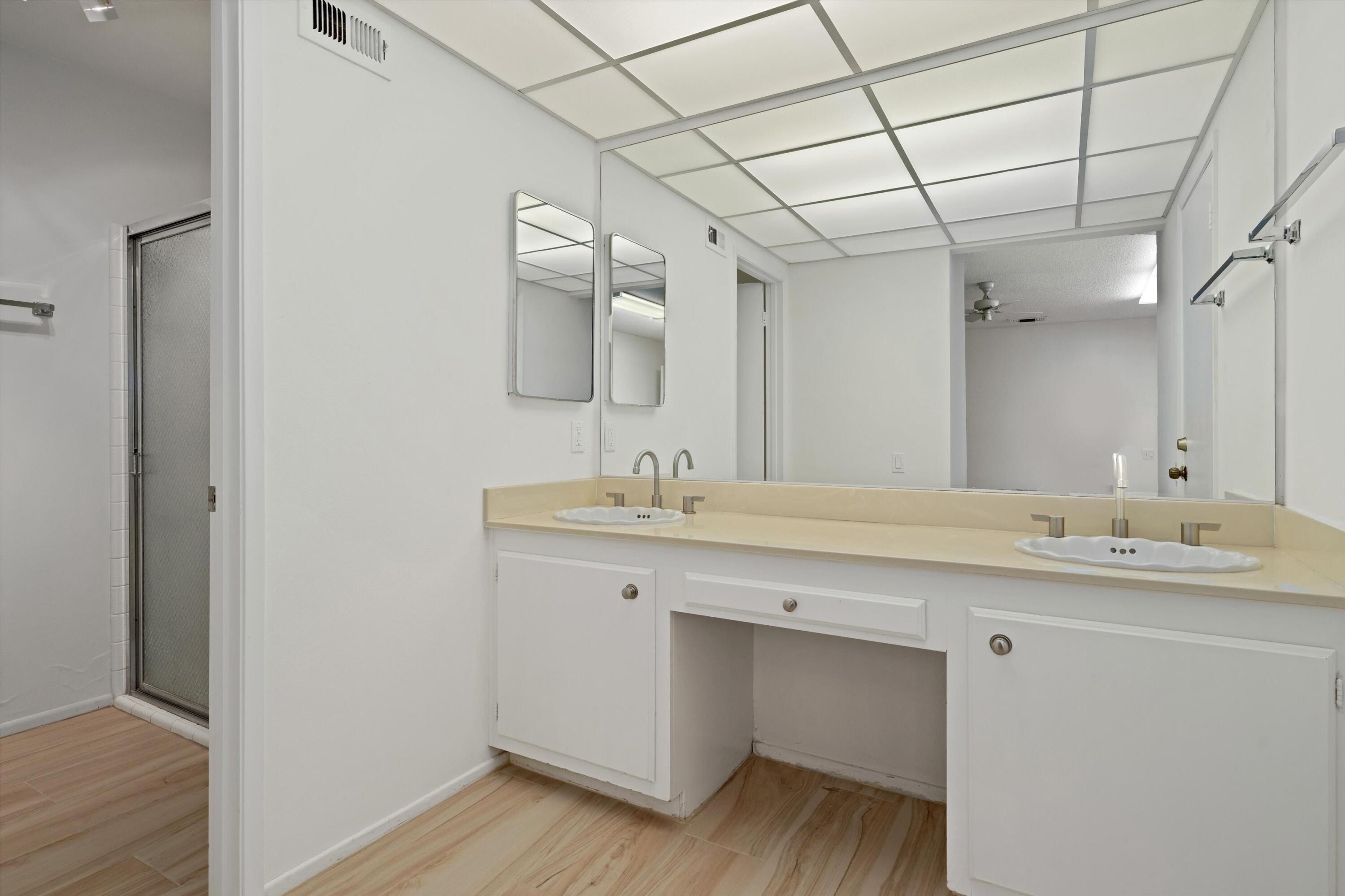 40270 Paseo Del Rey Rancho Mirage, CA 92270 - Photo 29 of 41 a bathroom with a double vanity sink and mirror