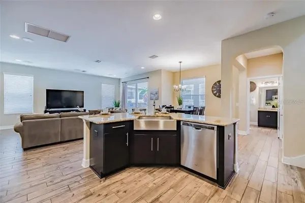a dining room with furniture window and wooden floor