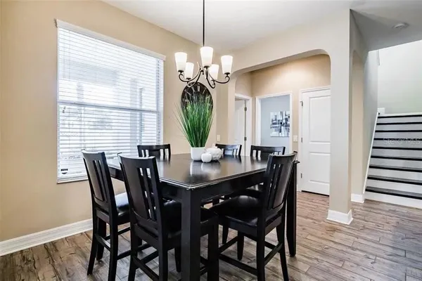 a kitchen with stainless steel appliances kitchen island granite countertop a refrigerator and a sink
