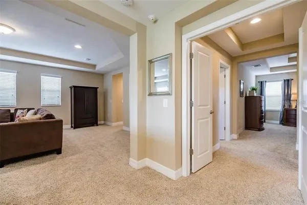 a bedroom with a bed and a lamp