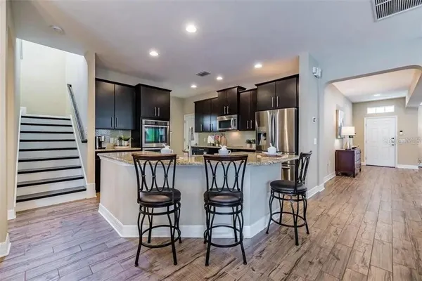a view of a dining room with furniture and a window